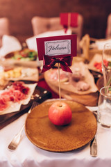 festive table awaits guests. the inscription 