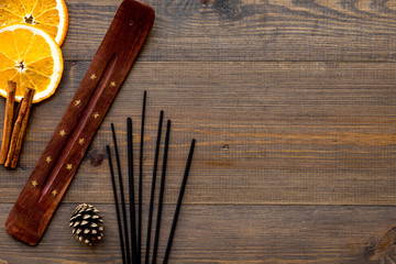 citrus and cinnamon fragrance diffuser for air freshness on wooden background top view mock-up