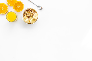 Healthy granola and orange juice for colorful breakfast on white background top view mock-up