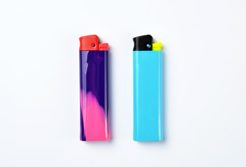 Multi colored lighters on white 