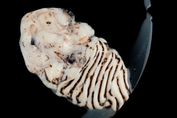 top view ice cream cone melting completely on black background