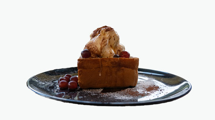 Ice cream bread in a black dish on a white background