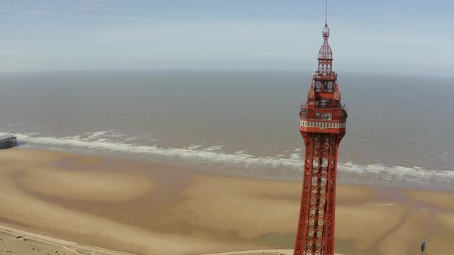 Stunning aerial footage, view of Blackpool Tower by the award winning Blackpool beach, A very popular seaside tourist location in England , United Kingdom, UK