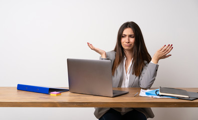Business woman in a office unhappy because not understand something
