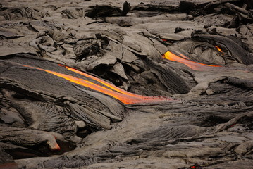 Obraz premium Lava field with new hot flowing lava in Big Island in Hawaii