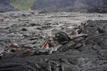 Lava field with new hot flowing lava in Big Island in Hawaii
