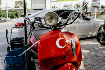 ISTANBUL, TURKEY - SEPTEMBER 2018: Red scooter with the image of the Turkish flag