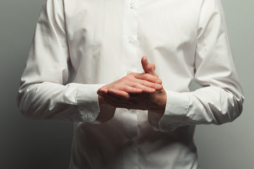 Man hands is ready for praying. Close up. Studio shot