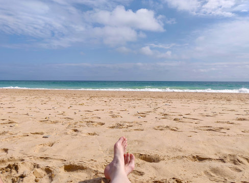 feet on the beach