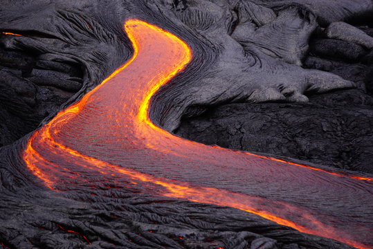 Lava field with new hot flowing lava in Big Island in Hawaii