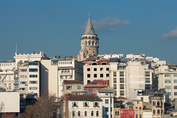 Galata Tower in Istanbul, Turkey. A view from water of Golden Horn bay. Sunny day. Text space. Outdoor shot