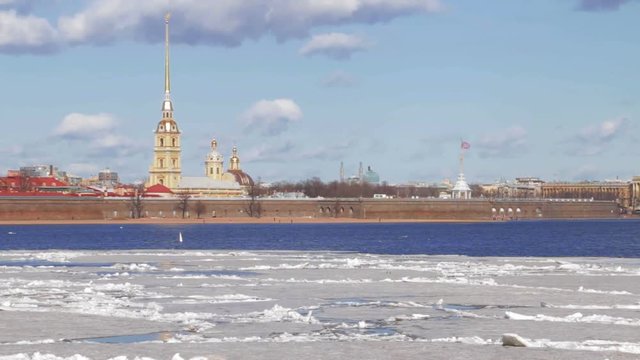 Saint Petersburg, Russia - Peter and Paul fortress first historical building in city. Winter sunny day in spring during ice breakup and ice drift on Neva river. Soft focus.