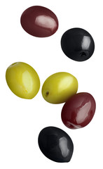 Flying green, black and red olives, isolated on white background