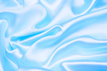 Smooth elegant blue silk or satin texture can use as abstract background