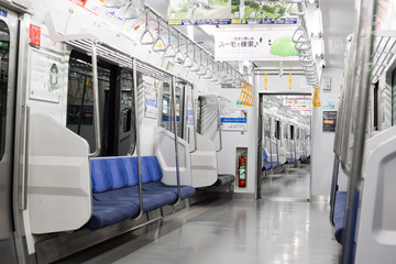 Chiba, Japan, 03/23/2019 , Train to tokyo on the Chuo-Sobu line at 5am.