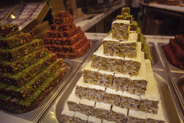 Turkish delight concept. Bunch of colorful rahat lokum in Istanbul dessert shop. Outdoor shot