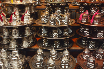 Traditional handmade tea and coffee sets for sale at the Egyptian Bazaar and the Grand Bazaar in Istanbul, Turkey. Outdoor shot