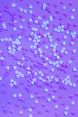 Violet neon background with white and violet little hearts.