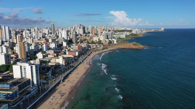 Aerial view of cityscape of Salvador, modern city skyline with skyscrapers, beach Praia Farol da Barra - Bahia, Brazil, landscape panorama of South America from above