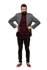 Naklejka premium Handsome man with glasses angry over isolated white background