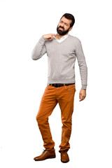 Handsome man with tired and sick expression over isolated white background