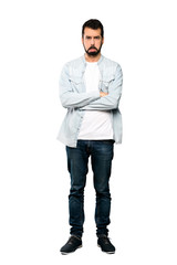 Naklejka premium Full-length shot of Handsome man with beard with sad and depressed expression over isolated white background