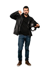 Full-length shot of Biker man showing thumb down over isolated white background