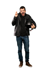 Naklejka premium Full-length shot of Biker man with fingers crossing over isolated white background