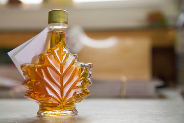 Canadian traditional maple syrup leaf bottle with copy space