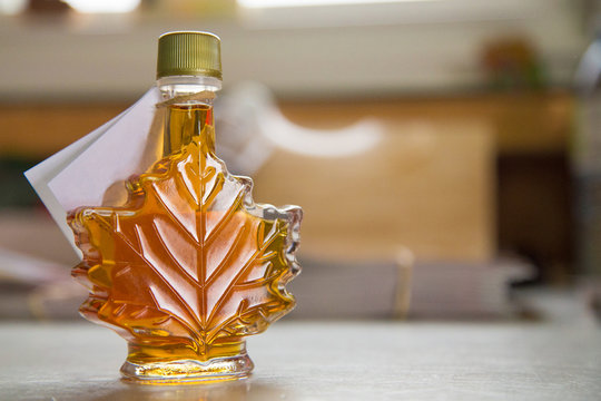 Canadian traditional maple syrup leaf bottle with copy space