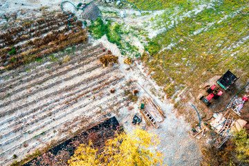 Agricultural machienery in big field - aerial view. Farming with tractor.