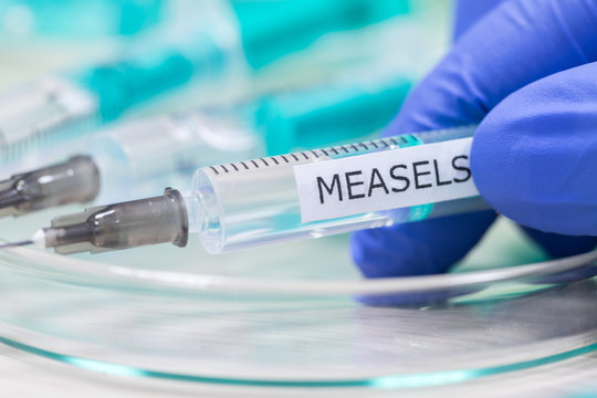 measels vaccination syringe background