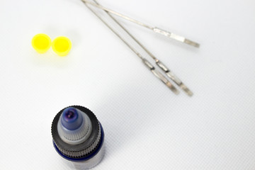 Tattoo equipment, tattoo ink and needle on white background