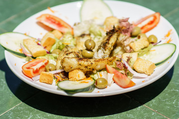 fish salad served in a deep plate, selective focus photography