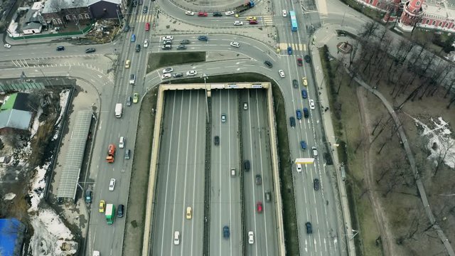 Aerial down view of a busy wide city road