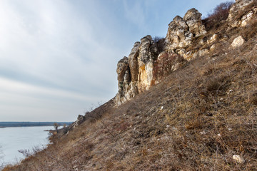 Fototapeta na wymiar The rocky chalk formation on the coast of the pond. Lisogorka, Rostov-on-Don region, Russia