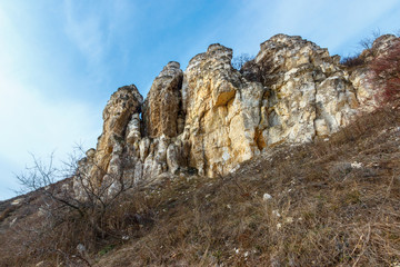 Fototapeta na wymiar The chalk geological formation among dry grassland. Lisogorka, Rostov-on-Don region, Russia