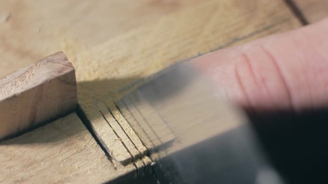 woodworker gash the teeth of a wood comb