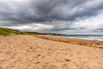 Fototapeta na wymiar Dramatic sky at Cocklawburn Beach near Berwick-upon-Tweed in Northumberland, England, UK