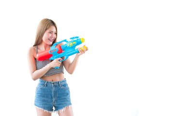 Asian sexy woman with gun water in hand on white background,Festival songkran day at thailand,The best of festival of thai,Land of  smile