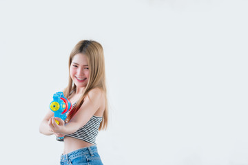 Asian sexy woman with gun water in hand on white background,Festival songkran day at thailand,The best of festival of thai,Land of  smile