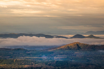 Sunrise at Phu Thok, view misty morning  around with mist and cloudy sky,  beautiful mountain. Khan District, Loei, Thailand