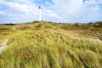 Fototapeta na wymiar Historic Lyngvig lighthouse in Jutland, North Sea coast in Denmark