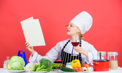 Interested in becoming a culinary professional. Pretty woman learning the best culinary arts. Professional cook developing her culinary skills in kitchen. Being a culinary genius