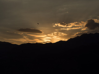 Paragliding during sunset lake Garda Italy