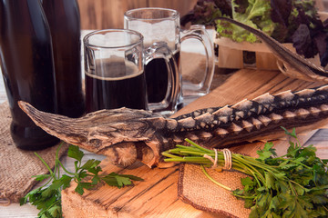 Dried sturgeon with dark beer and greens