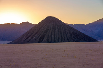 Fototapeta premium Black mountain at sunset