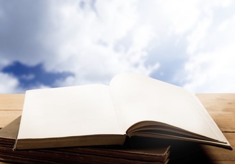 Open book on table isolated on  background