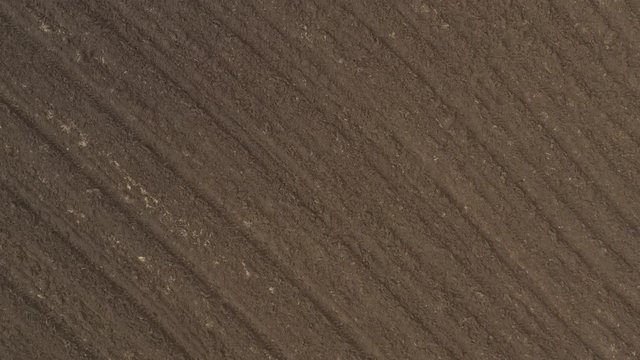 Ploughed earth ready for agricultural work 4K drone video