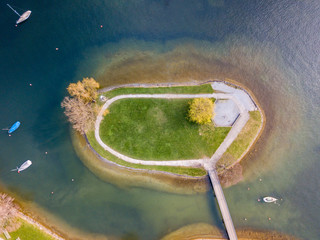 Aerial view of small island near coast on a lake in Switzerland
